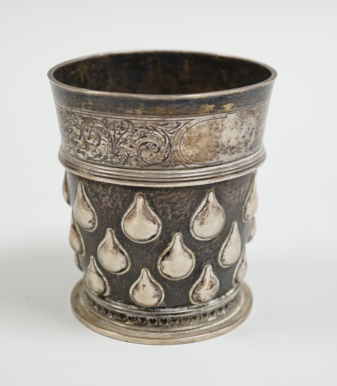 A Swiss 875 standard white metal beaker, by I. Bossard, embossed with field of pears and engraved band of hearts, 86mm, 5.9oz.